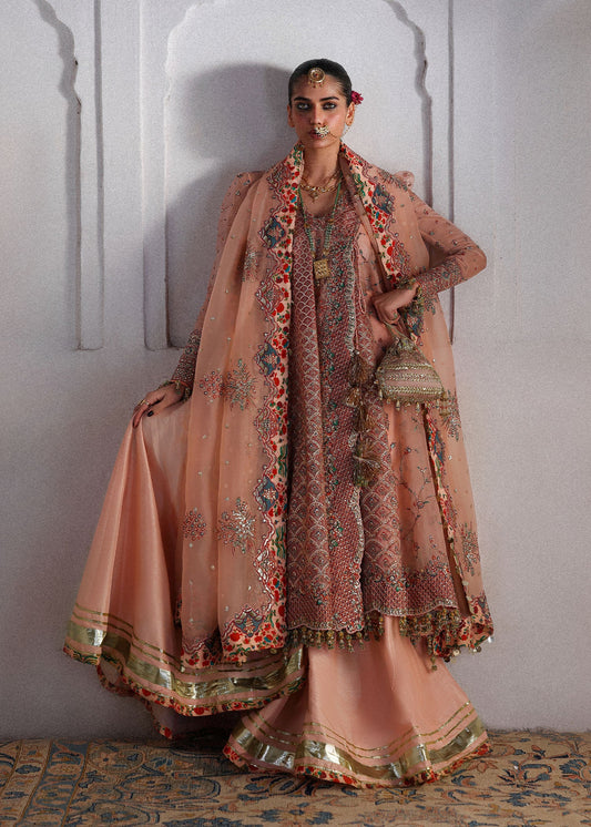 Elegant peachy pink organza angrakha pishwas with embroidered panels and sleeves, paired with Korean raw silk sharara and an organza dupatta.