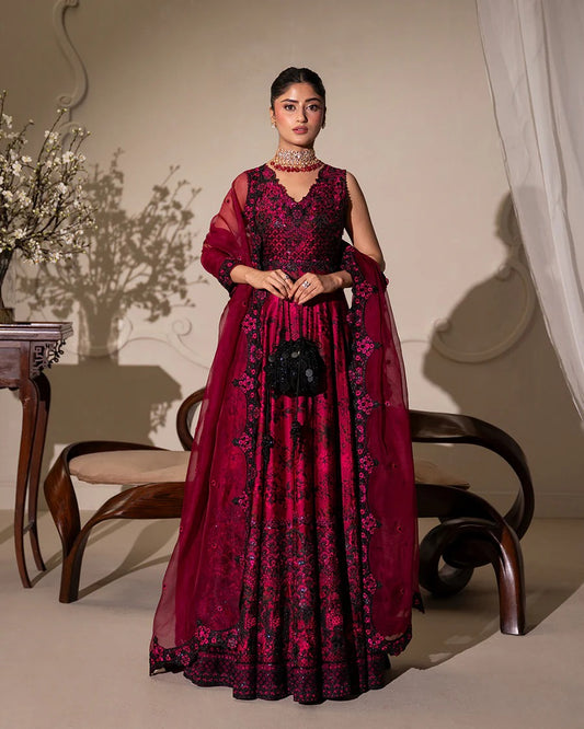Havin set in dark magenta shamose silk with printed and embroidered shirt, paired with embroidered organza/net dupatta and silk trousers—perfect for festive occasions.