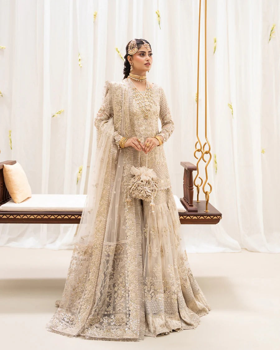 Safak ivory net gharara set with gold embroidery, featuring detailed shirt panels, embroidered dupatta, and gharara—perfect for weddings and festive celebrations.