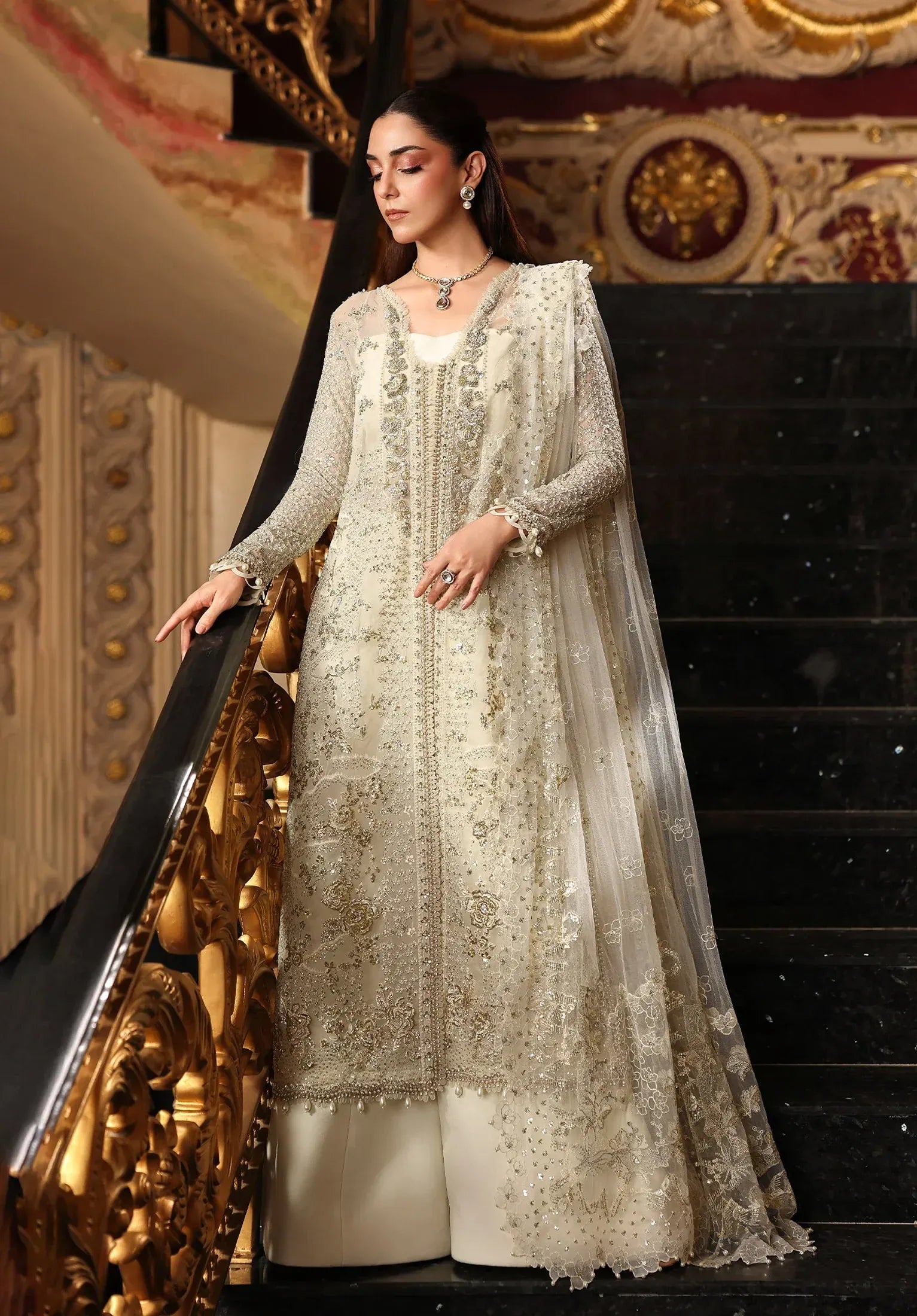 Celestia by Elaf Stardom ’25 features hand-embellished organza panels, embroidered dupatta, and raw silk inner — a timeless choice for refined elegance.