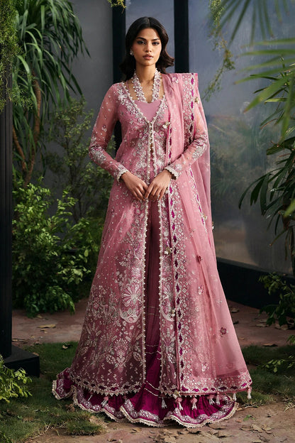 Chic pink organza dress with multi-panel embroidery, magenta silk trouser borders, and tie-dye trousers. Includes dupatta with pallu border for a vibrant look.