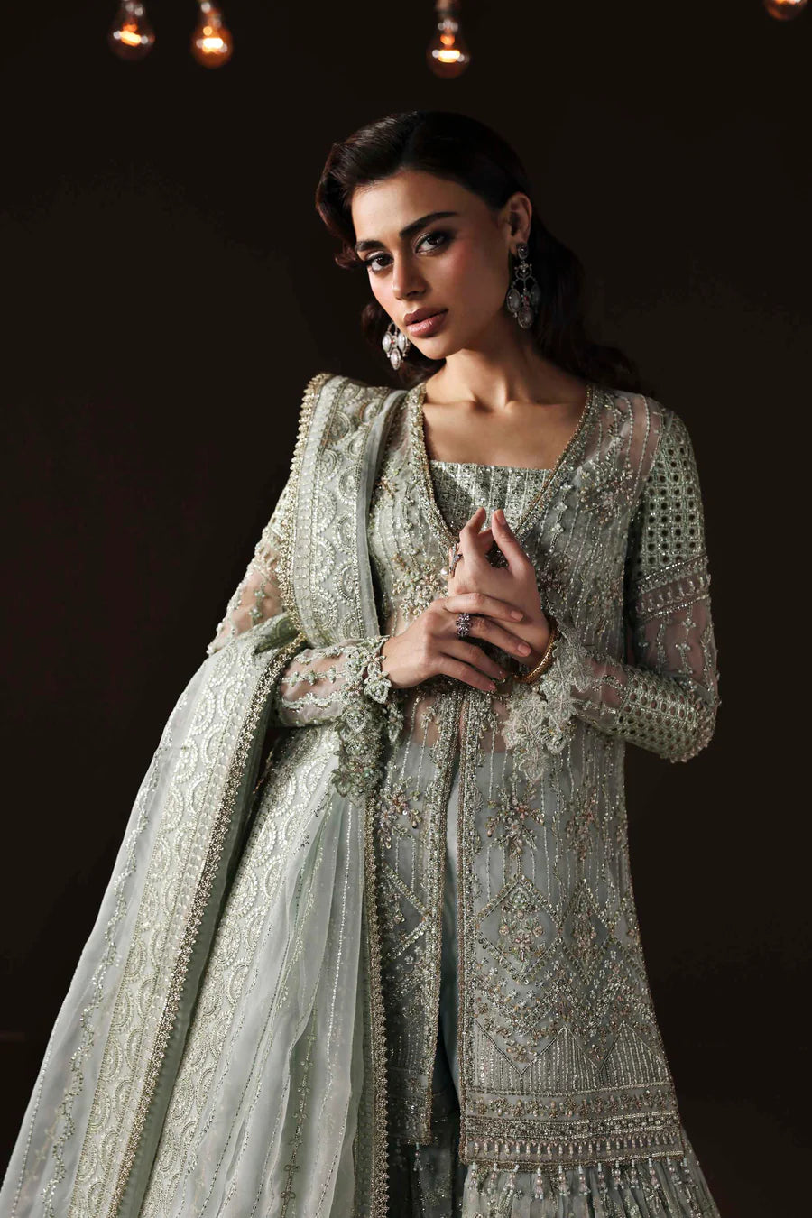 Shop organza embroidered sharara dress with hand embellishments & dupatta. Includes detailed borders & inner—perfect for weddings & festive wear.