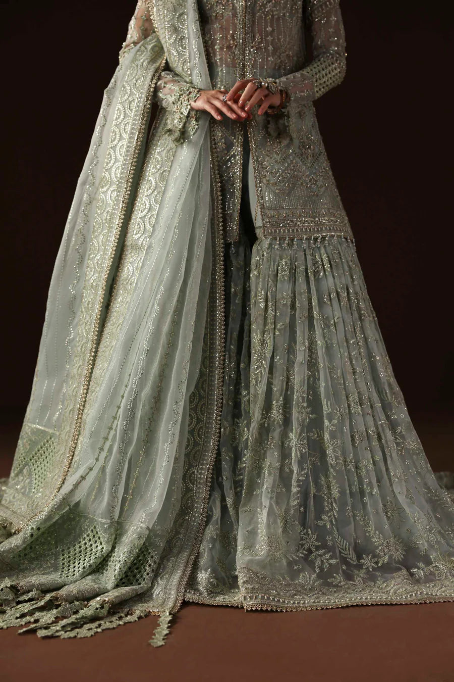 Shop organza embroidered sharara dress with hand embellishments & dupatta. Includes detailed borders & inner—perfect for weddings & festive wear.
