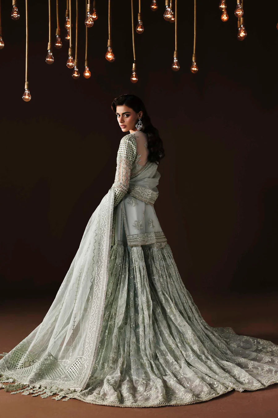 Shop organza embroidered sharara dress with hand embellishments & dupatta. Includes detailed borders & inner—perfect for weddings & festive wear.
