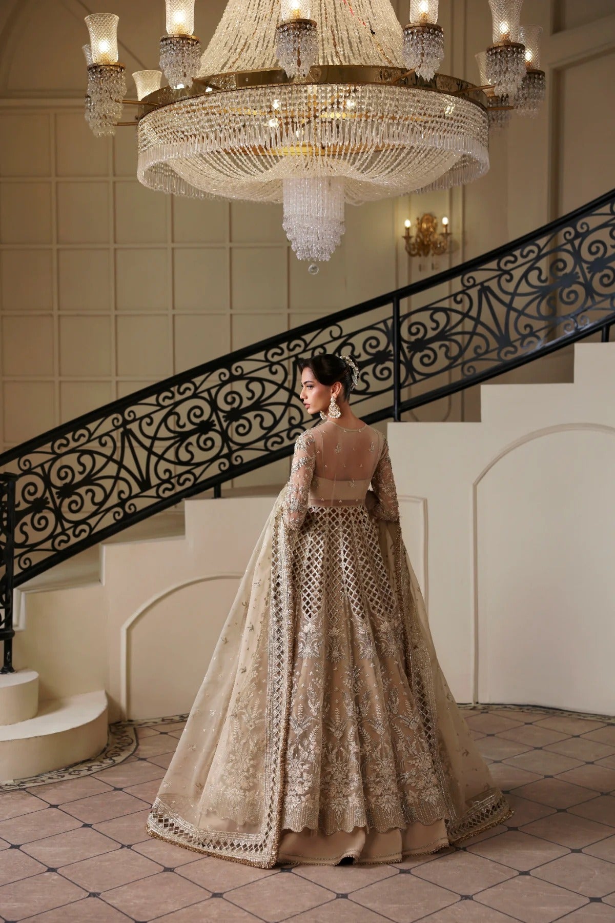 Luxurious hand-embellished organza dress with detailed panels, embroidered dupatta, Russian grip inner, and raw silk lehenga fabric for a regal ensemble.