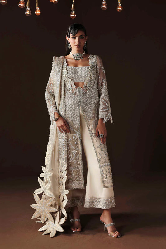 Shop organza embroidered dress with hand embellishments, raw silk trousers & dupatta. Features 3D floral details—perfect for weddings & festive wear.
