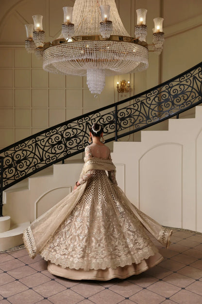 Luxurious hand-embellished organza dress with detailed panels, embroidered dupatta, Russian grip inner, and raw silk lehenga fabric for a regal ensemble.