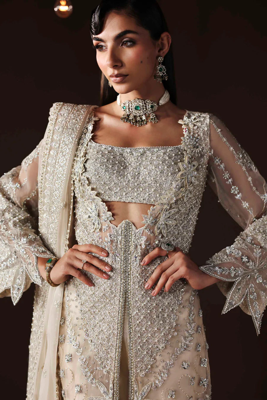 Shop organza embroidered dress with hand embellishments, raw silk trousers & dupatta. Features 3D floral details—perfect for weddings & festive wear.