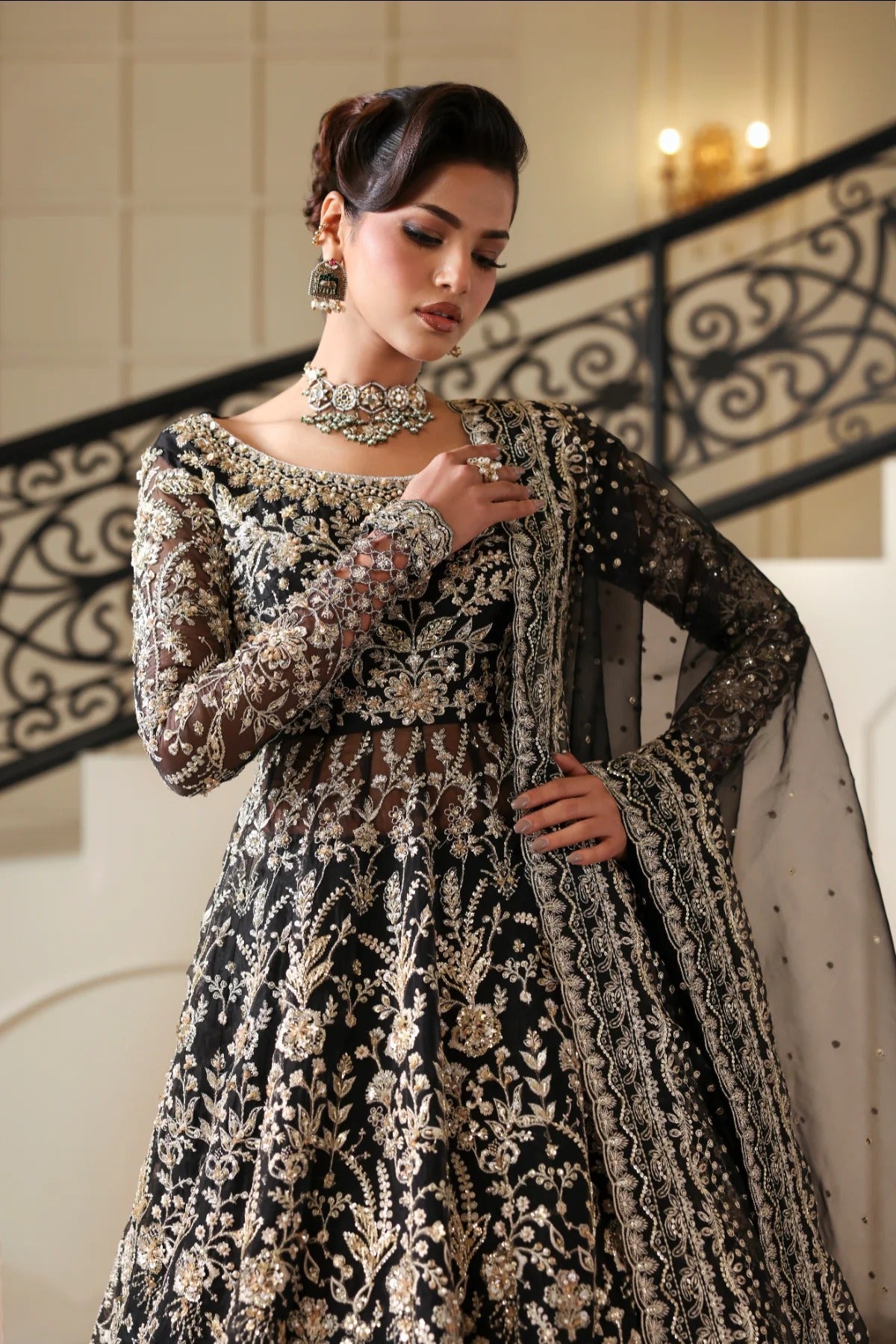 Stunning hand-embellished organza outfit with detailed panels, matching dupatta, Russian grip inner, and raw silk lehenga fabric. Ideal for formal occasions.
