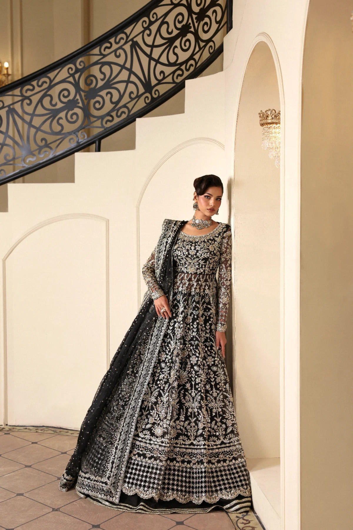 Stunning hand-embellished organza outfit with detailed panels, matching dupatta, Russian grip inner, and raw silk lehenga fabric. Ideal for formal occasions.