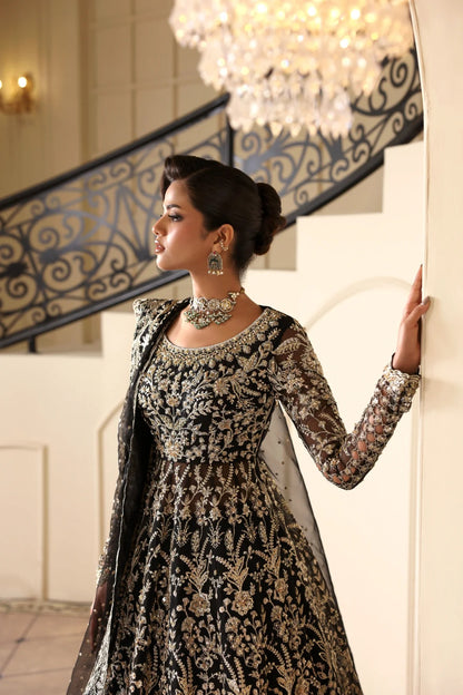 Stunning hand-embellished organza outfit with detailed panels, matching dupatta, Russian grip inner, and raw silk lehenga fabric. Ideal for formal occasions.