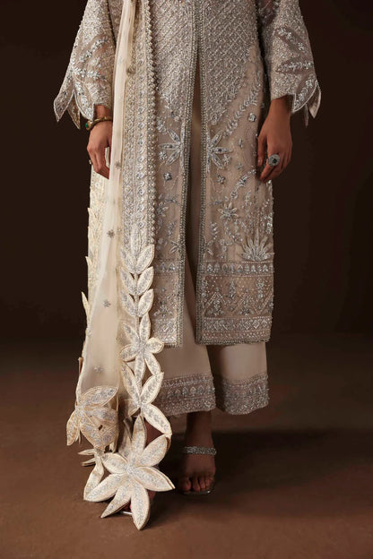Shop organza embroidered dress with hand embellishments, raw silk trousers & dupatta. Features 3D floral details—perfect for weddings & festive wear.