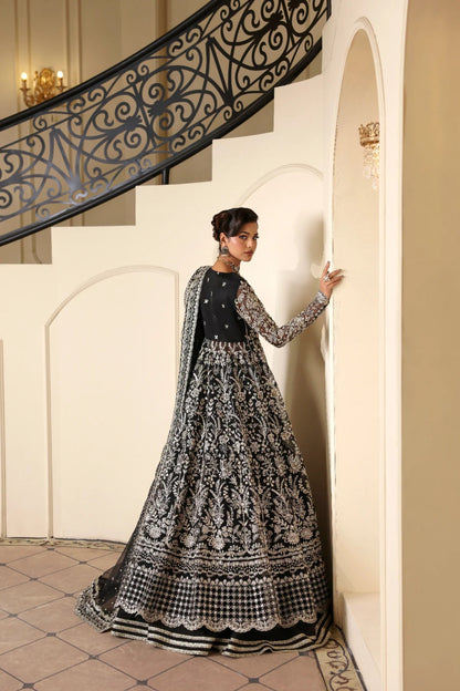 Stunning hand-embellished organza outfit with detailed panels, matching dupatta, Russian grip inner, and raw silk lehenga fabric. Ideal for formal occasions.