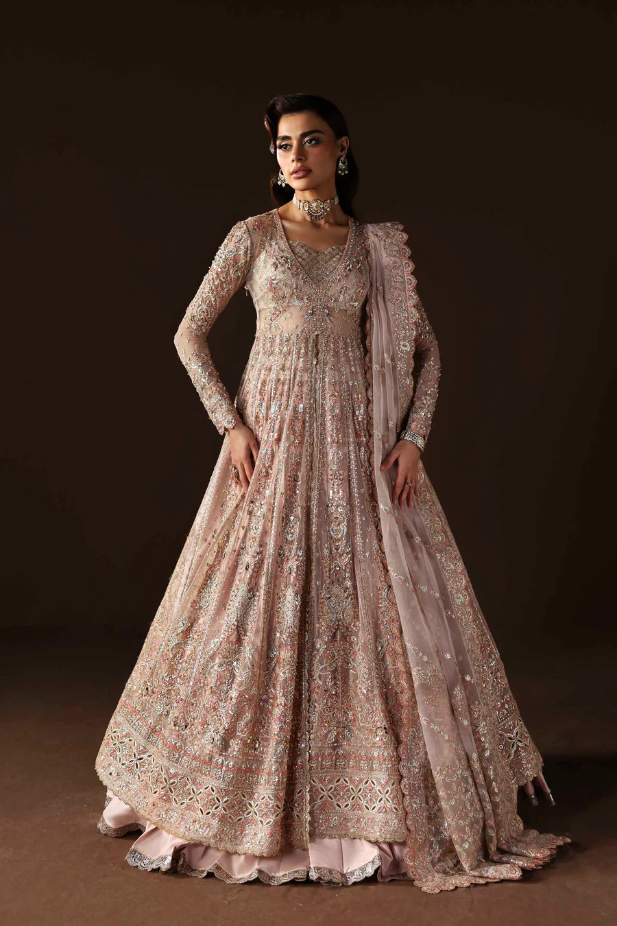 Shop organza embroidered lehenga with hand embellished blouse, panels & dupatta. Includes raw silk lehenga & lining—perfect for weddings & events.