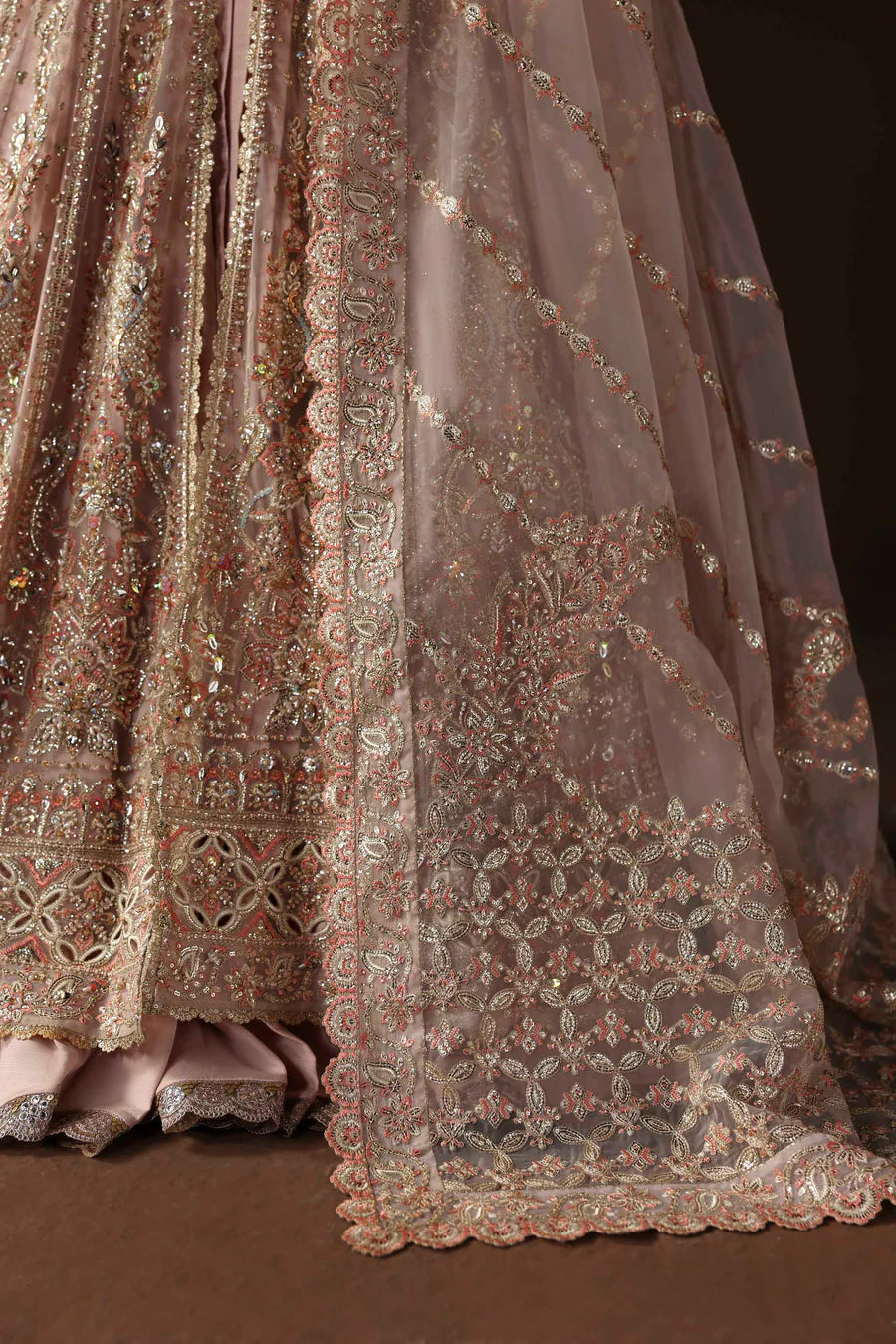 Shop organza embroidered lehenga with hand embellished blouse, panels & dupatta. Includes raw silk lehenga & lining—perfect for weddings & events.