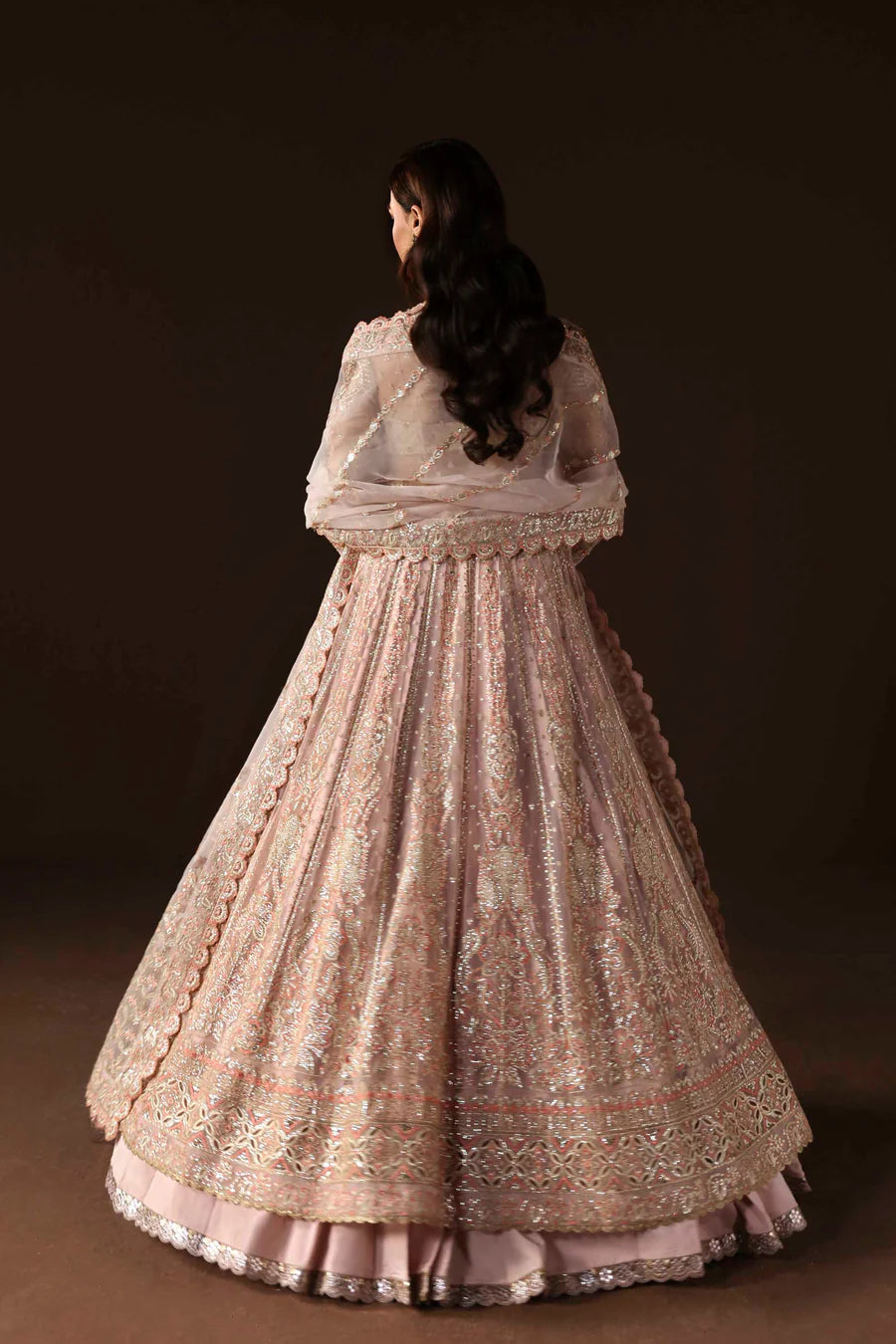 Shop organza embroidered lehenga with hand embellished blouse, panels & dupatta. Includes raw silk lehenga & lining—perfect for weddings & events.