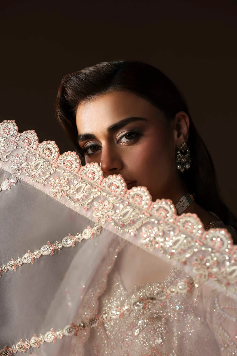 Shop organza embroidered lehenga with hand embellished blouse, panels & dupatta. Includes raw silk lehenga & lining—perfect for weddings & events.