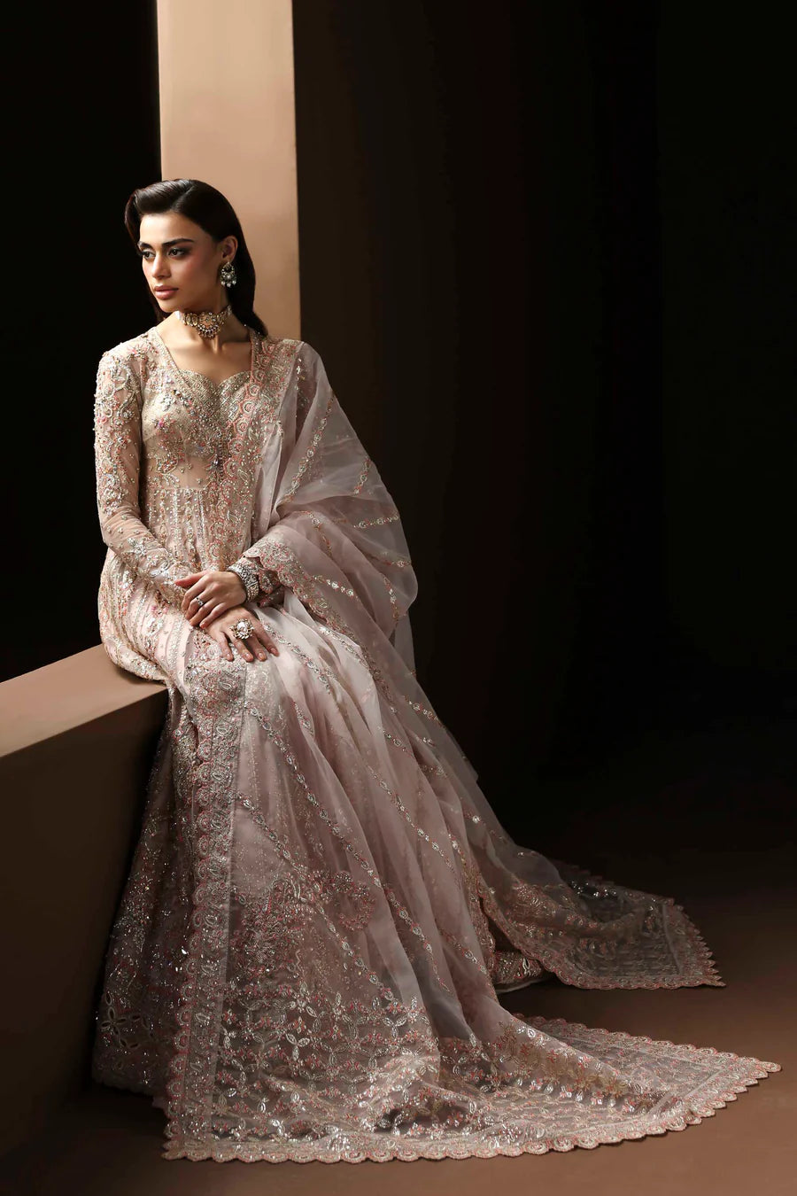 Shop organza embroidered lehenga with hand embellished blouse, panels & dupatta. Includes raw silk lehenga & lining—perfect for weddings & events.