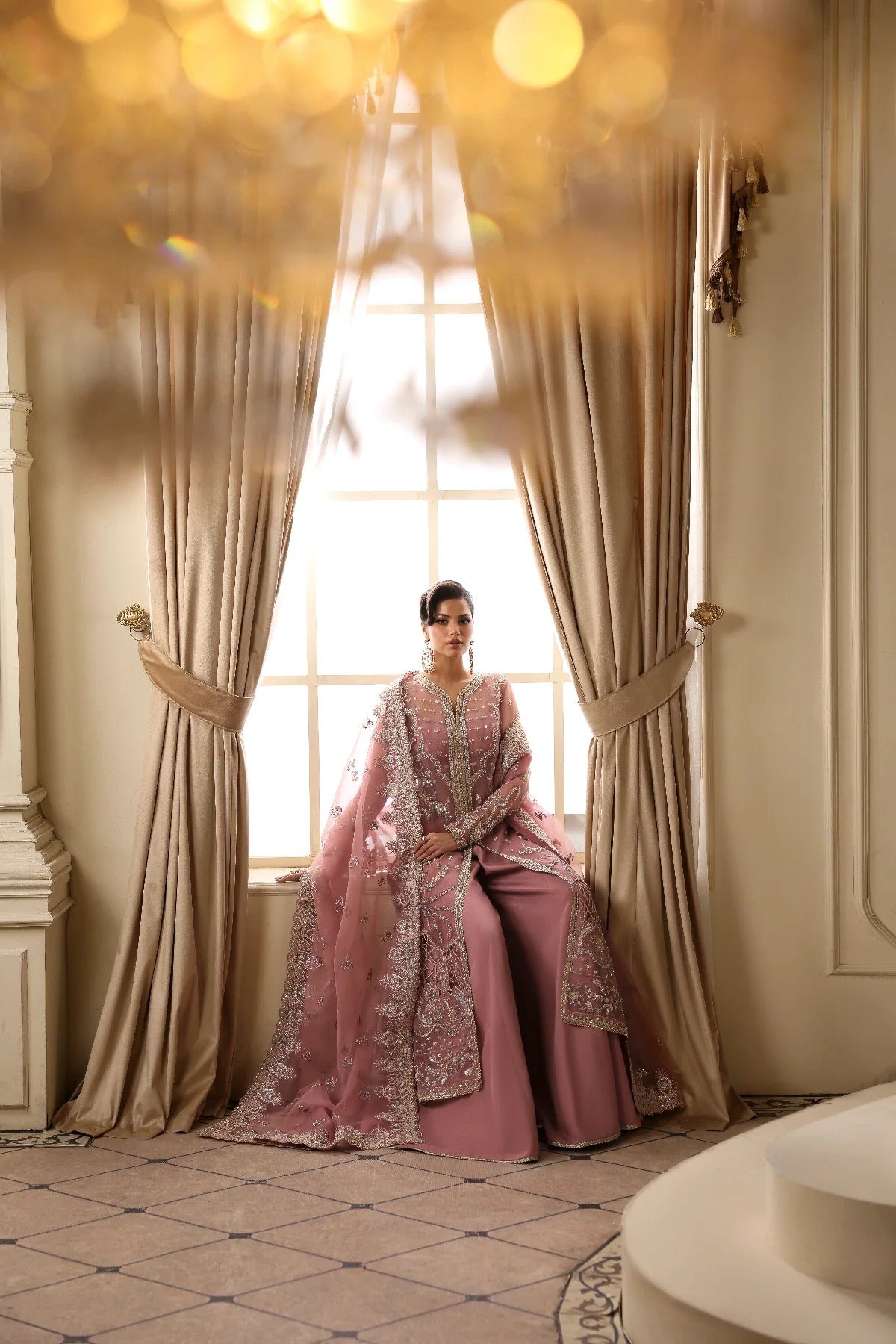 Elegant organza dress featuring hand-embellished panels, sleeves, chok patti, borders, and dupatta. Includes Russian grip inner and raw silk trouser fabric.