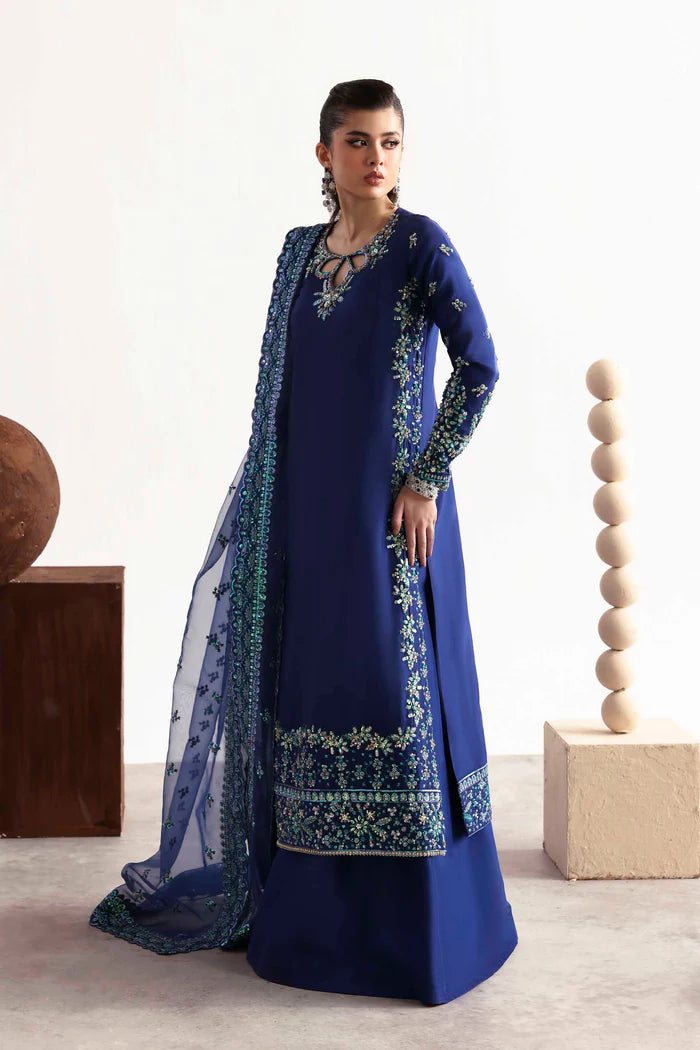 Luxury silk suit featuring hand-embroidered front, back, and sleeves, dyed silk trouser, and a 3-yard organza dupatta for a complete festive ensemble.