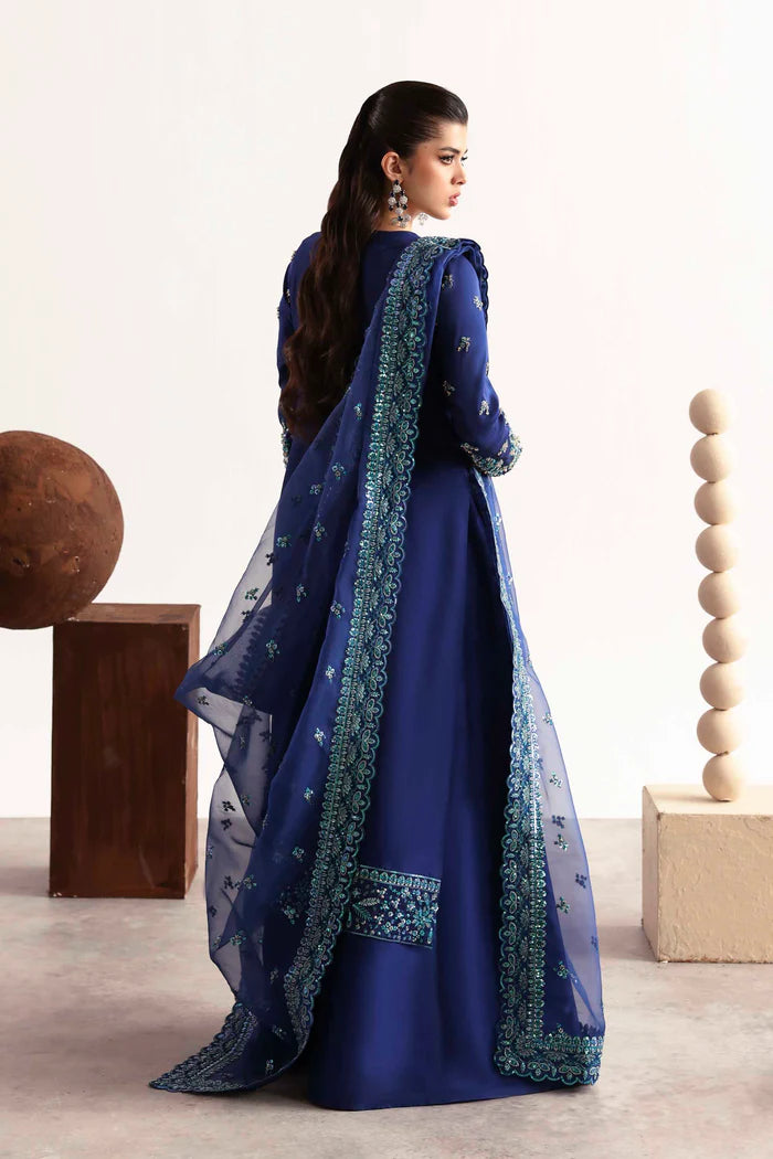 Luxury silk suit featuring hand-embroidered front, back, and sleeves, dyed silk trouser, and a 3-yard organza dupatta for a complete festive ensemble.