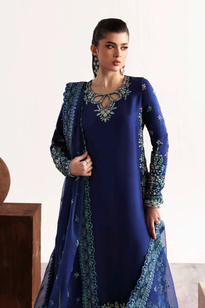 Luxury silk suit featuring hand-embroidered front, back, and sleeves, dyed silk trouser, and a 3-yard organza dupatta for a complete festive ensemble.