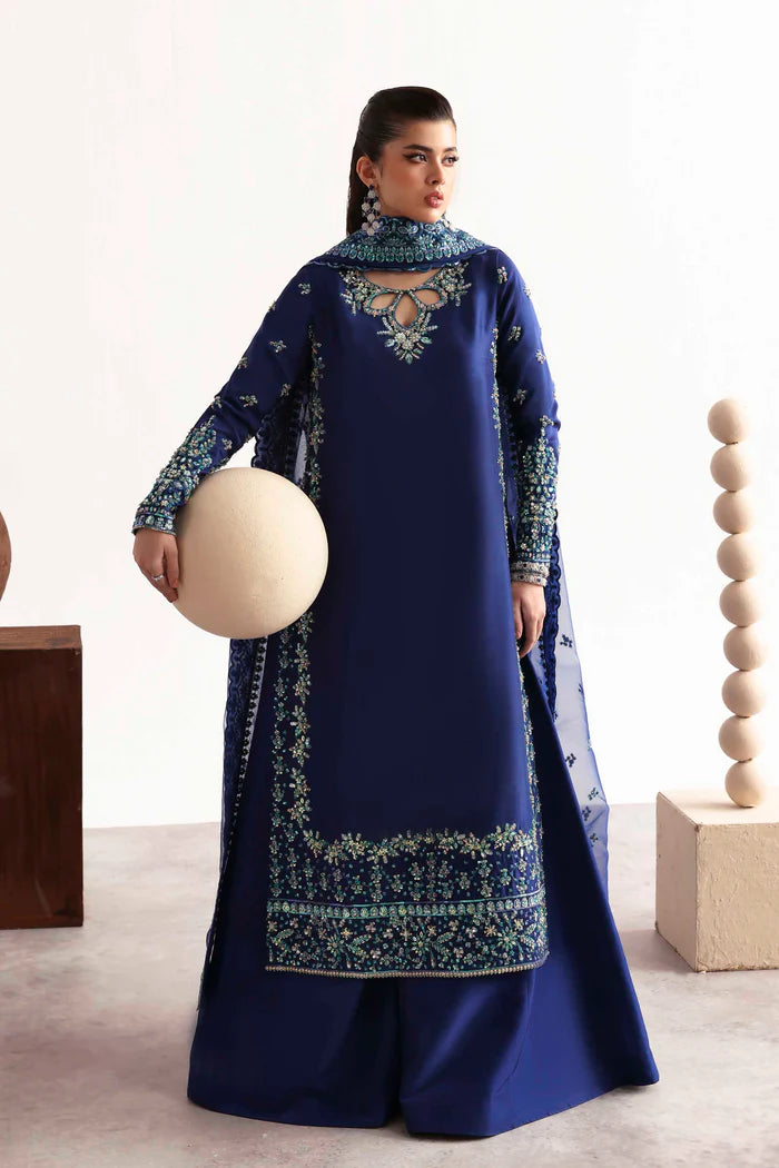 Luxury silk suit featuring hand-embroidered front, back, and sleeves, dyed silk trouser, and a 3-yard organza dupatta for a complete festive ensemble.