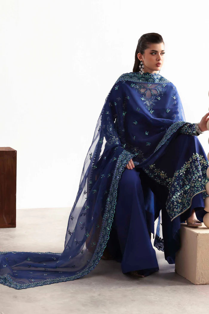 Luxury silk suit featuring hand-embroidered front, back, and sleeves, dyed silk trouser, and a 3-yard organza dupatta for a complete festive ensemble.