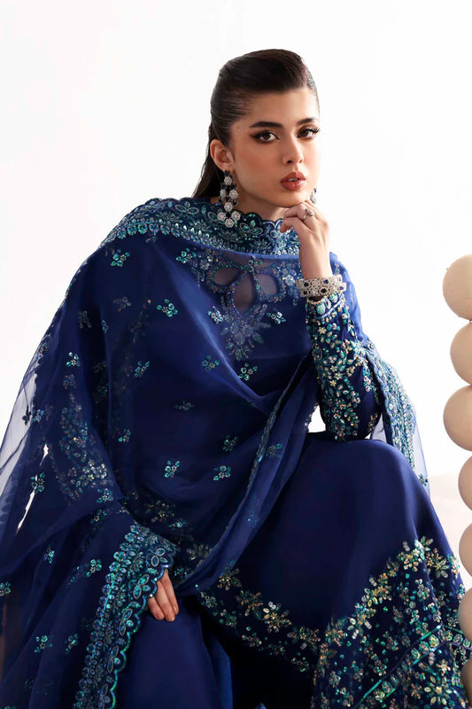 Luxury silk suit featuring hand-embroidered front, back, and sleeves, dyed silk trouser, and a 3-yard organza dupatta for a complete festive ensemble.