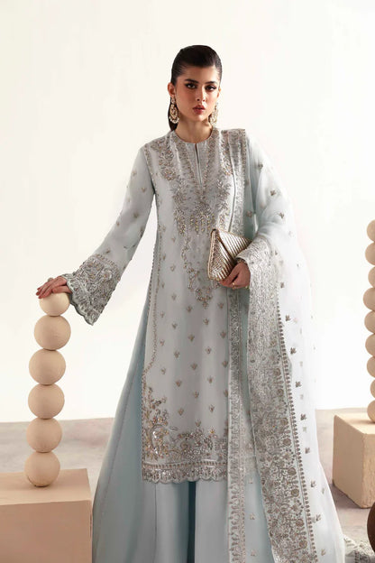 Elegant silk suit featuring hand-embroidered front, back, sleeves, chalk borders, dyed silk trouser, and a 3-yard organza dupatta for a complete festive look