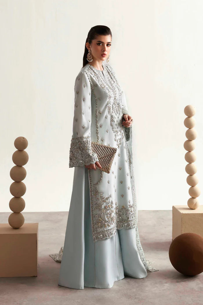 Elegant silk suit featuring hand-embroidered front, back, sleeves, chalk borders, dyed silk trouser, and a 3-yard organza dupatta for a complete festive look