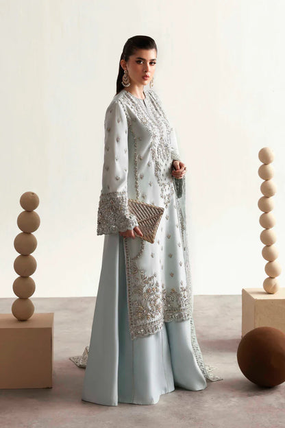 Elegant silk suit featuring hand-embroidered front, back, sleeves, chalk borders, dyed silk trouser, and a 3-yard organza dupatta for a complete festive look