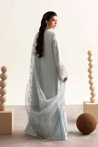 Elegant silk suit featuring hand-embroidered front, back, sleeves, chalk borders, dyed silk trouser, and a 3-yard organza dupatta for a complete festive look