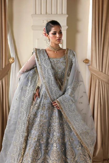 Elegant organza dress with hand embellishments, embroidered panels, matching dupatta, Russian grip inner, and 5-yard raw silk lehenga fabric. Perfect for events.