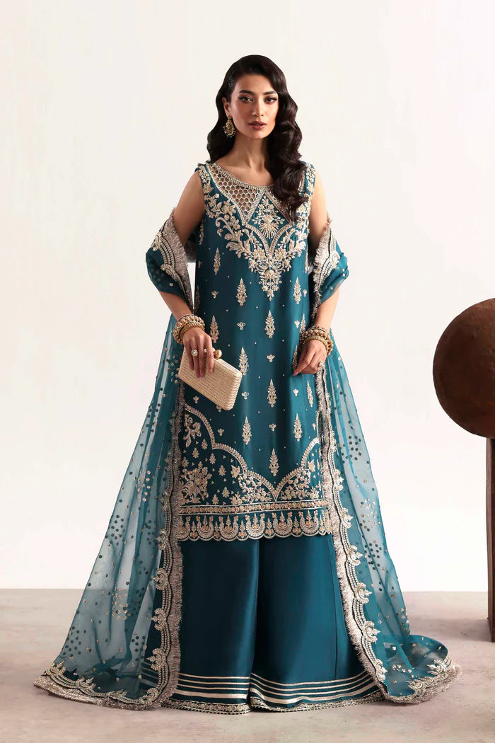 Luxury silk suit featuring hand-embroidered front, back, and sleeves, dyed silk trouser with organza border, and a 3-yard embroidered organza dupatta ensemble.
