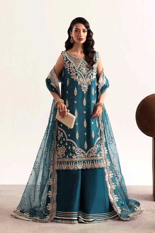 Luxury silk suit featuring hand-embroidered front, back, and sleeves, dyed silk trouser with organza border, and a 3-yard embroidered organza dupatta ensemble.