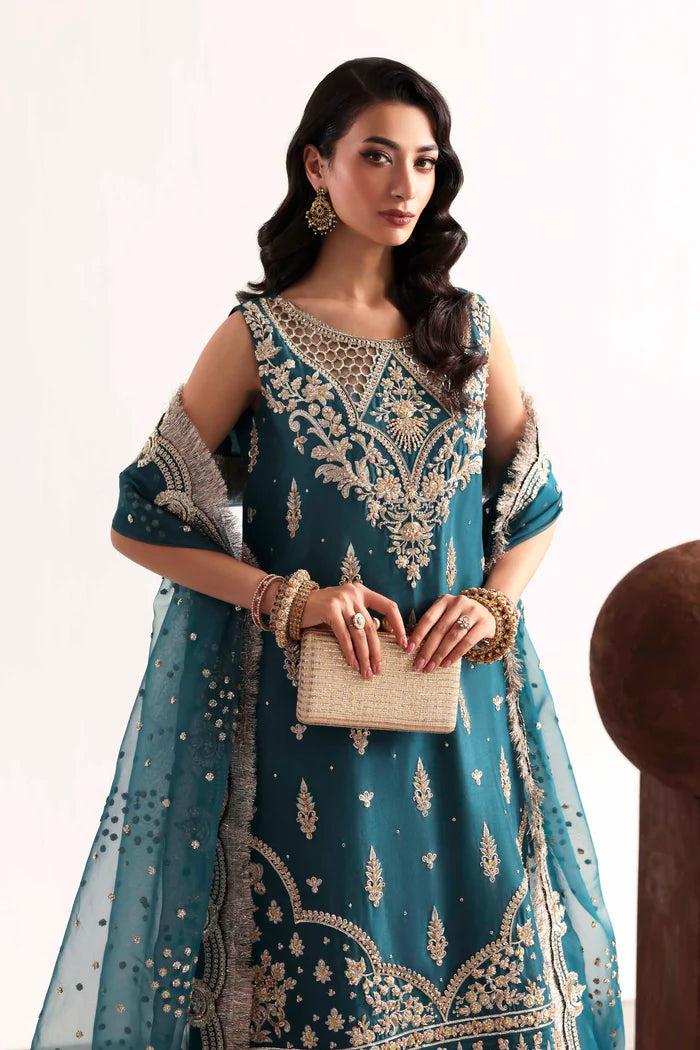 Luxury silk suit featuring hand-embroidered front, back, and sleeves, dyed silk trouser with organza border, and a 3-yard embroidered organza dupatta ensemble.
