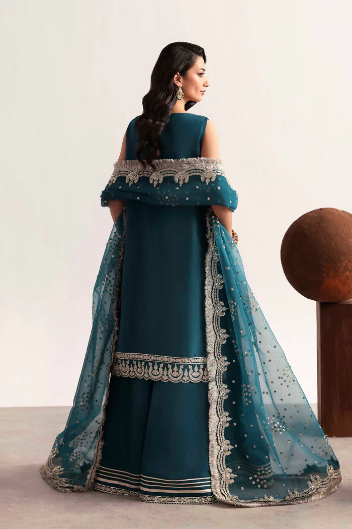 Luxury silk suit featuring hand-embroidered front, back, and sleeves, dyed silk trouser with organza border, and a 3-yard embroidered organza dupatta ensemble.