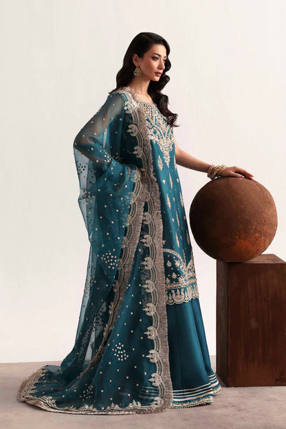 Luxury silk suit featuring hand-embroidered front, back, and sleeves, dyed silk trouser with organza border, and a 3-yard embroidered organza dupatta ensemble.