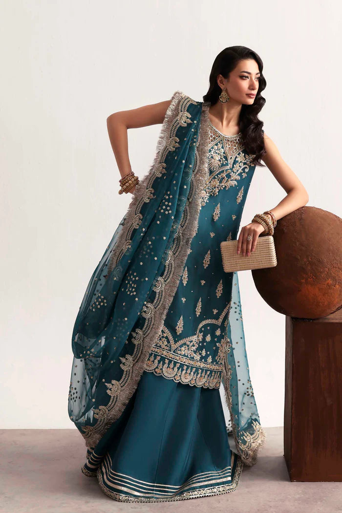 Luxury silk suit featuring hand-embroidered front, back, and sleeves, dyed silk trouser with organza border, and a 3-yard embroidered organza dupatta ensemble.