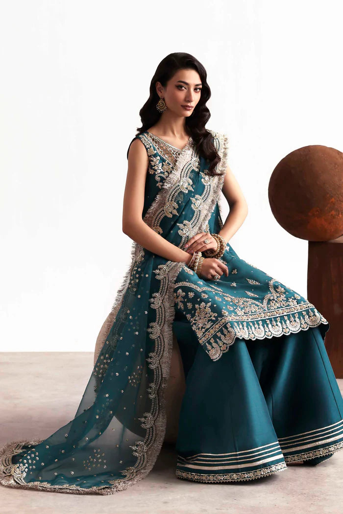 Luxury silk suit featuring hand-embroidered front, back, and sleeves, dyed silk trouser with organza border, and a 3-yard embroidered organza dupatta ensemble.