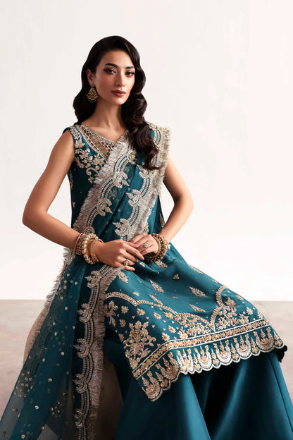 Luxury silk suit featuring hand-embroidered front, back, and sleeves, dyed silk trouser with organza border, and a 3-yard embroidered organza dupatta ensemble.