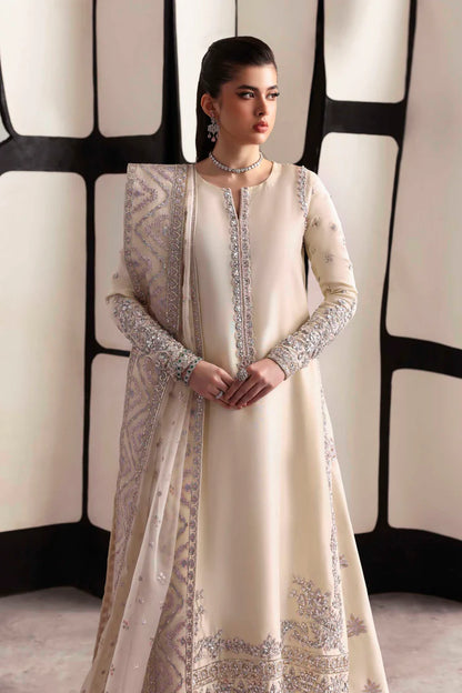 Elegant silk suit featuring hand-embroidered front, back, and sleeves, matching embroidered trouser, and a 3-yard organza dupatta for a complete festive look.