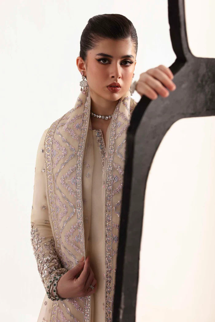 Elegant silk suit featuring hand-embroidered front, back, and sleeves, matching embroidered trouser, and a 3-yard organza dupatta for a complete festive look.