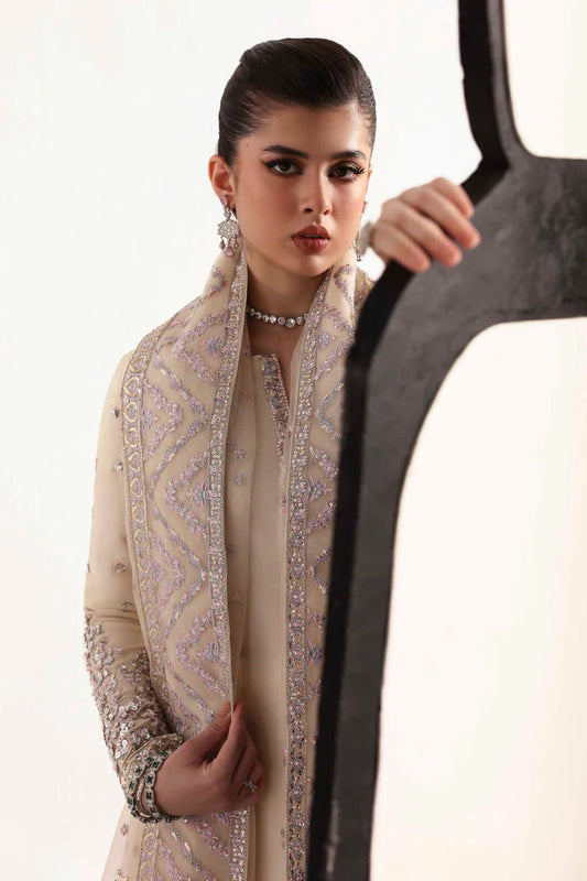 Elegant silk suit featuring hand-embroidered front, back, and sleeves, matching embroidered trouser, and a 3-yard organza dupatta for a complete festive look.