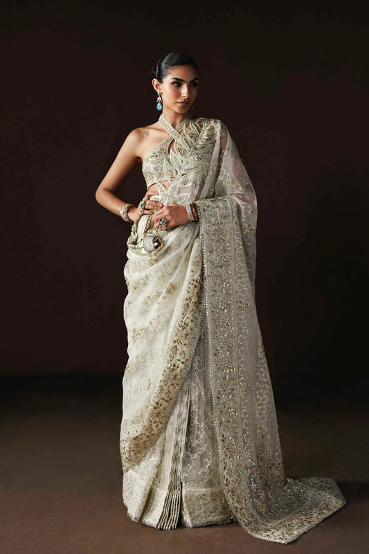 Shop luxury organza embroidered saree with hand embellished blouse, pallu & borders. Includes raw silk inner—perfect for weddings & festive wear.