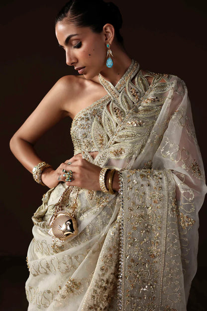 Shop luxury organza embroidered saree with hand embellished blouse, pallu & borders. Includes raw silk inner—perfect for weddings & festive wear.