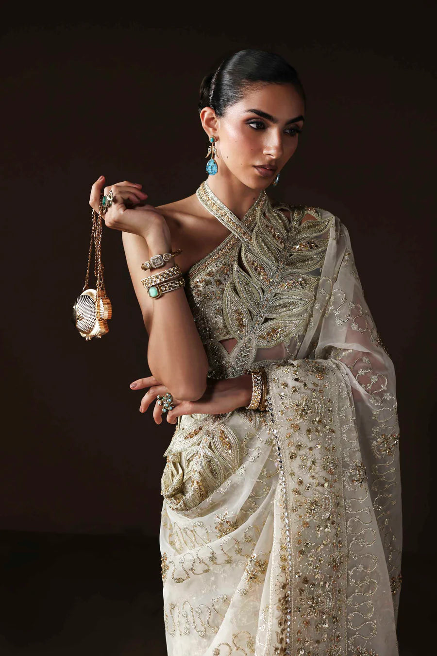 Shop luxury organza embroidered saree with hand embellished blouse, pallu & borders. Includes raw silk inner—perfect for weddings & festive wear.
