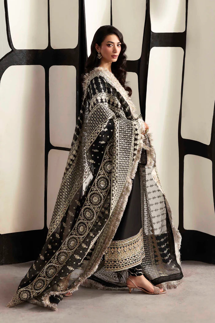 Luxury organza suit with hand-embroidered front and back necklines, detailed borders, embroidered dupatta, and dyed silk for front, back, sleeves, and trouser.