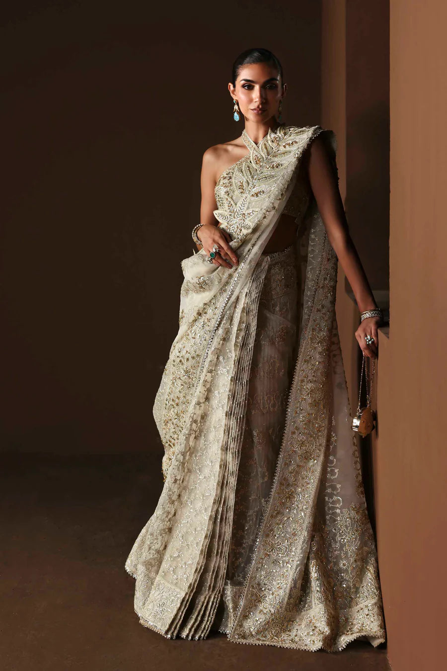 Shop luxury organza embroidered saree with hand embellished blouse, pallu & borders. Includes raw silk inner—perfect for weddings & festive wear.